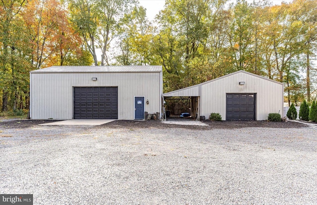 garage featuring wood walls