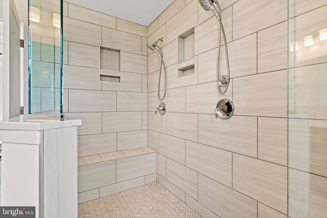 bathroom with tiled shower