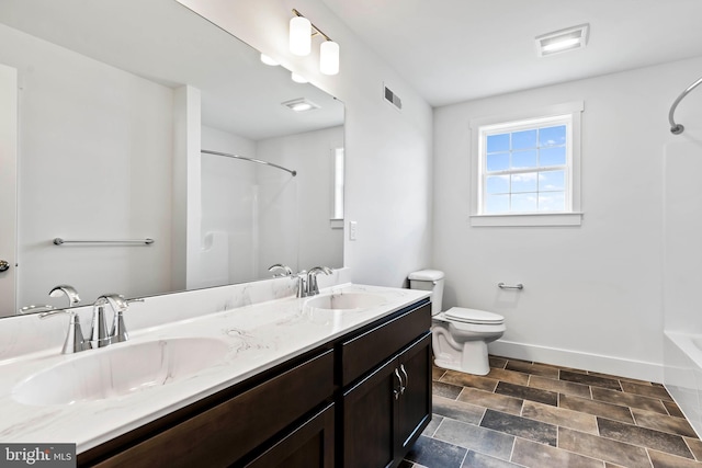 full bath featuring baseboards, visible vents, a sink, and toilet