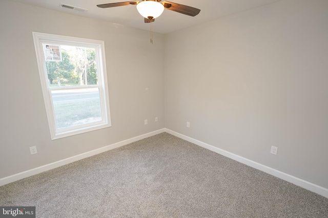 empty room with carpet flooring and ceiling fan