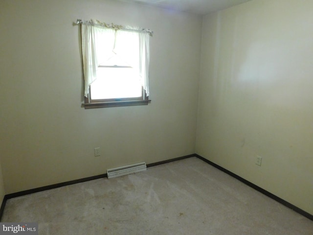 unfurnished room with light colored carpet