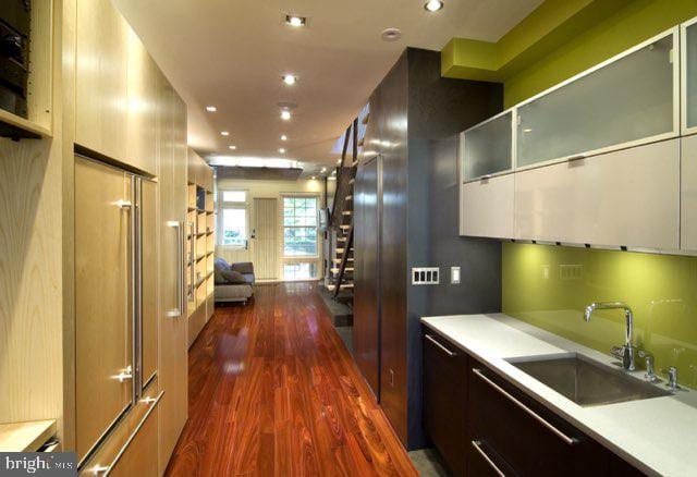 kitchen with dark hardwood / wood-style floors and sink