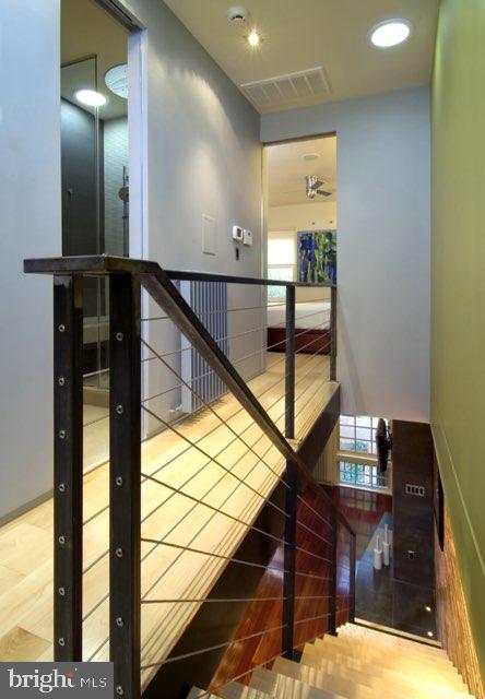 stairway featuring hardwood / wood-style floors