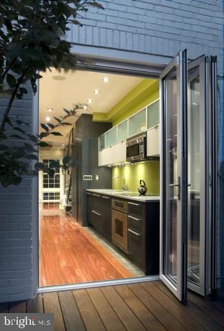 kitchen with white cabinetry and light hardwood / wood-style floors