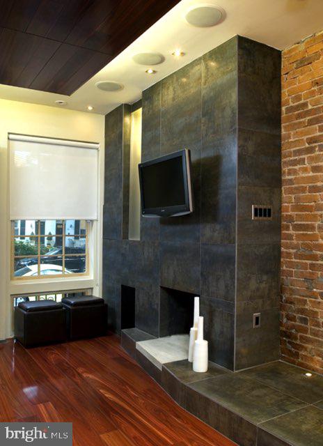 bathroom with hardwood / wood-style floors