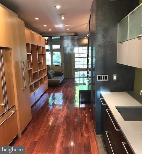 kitchen featuring dark hardwood / wood-style flooring and sink