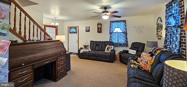 living room featuring light carpet and ceiling fan with notable chandelier