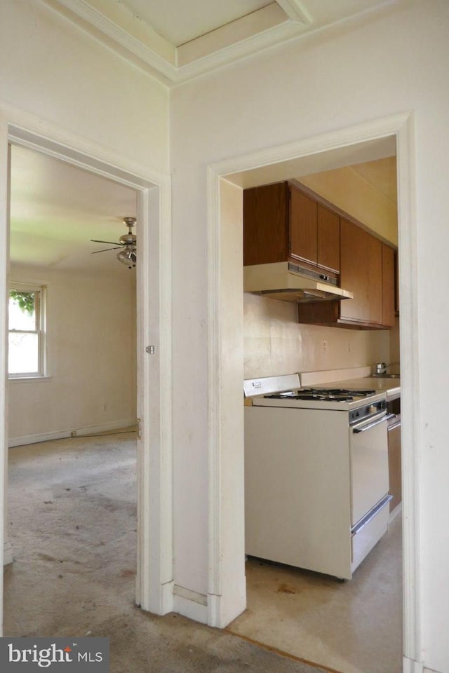 kitchen with ceiling fan, light carpet, and white range with gas stovetop