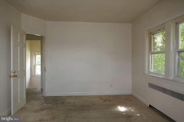 unfurnished room with radiator