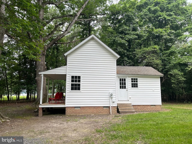 back of property with a yard