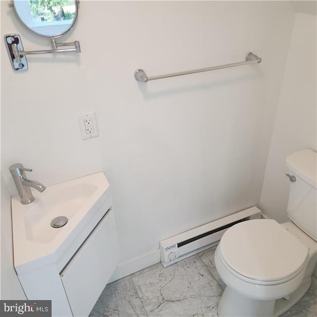 bathroom featuring vanity, toilet, and a baseboard radiator