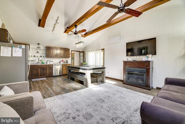 living room featuring beam ceiling, a wall mounted AC, high vaulted ceiling, and ceiling fan