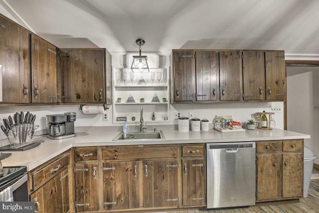 kitchen with sink, dishwasher, dark brown cabinetry, and decorative light fixtures