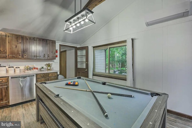 game room with billiards, vaulted ceiling, a wall unit AC, and light hardwood / wood-style floors