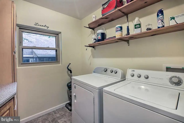 laundry area featuring cabinets and separate washer and dryer