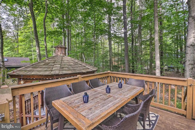 wooden terrace featuring a gazebo