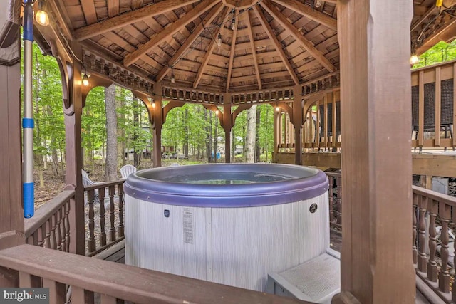 view of patio / terrace featuring a gazebo and a hot tub