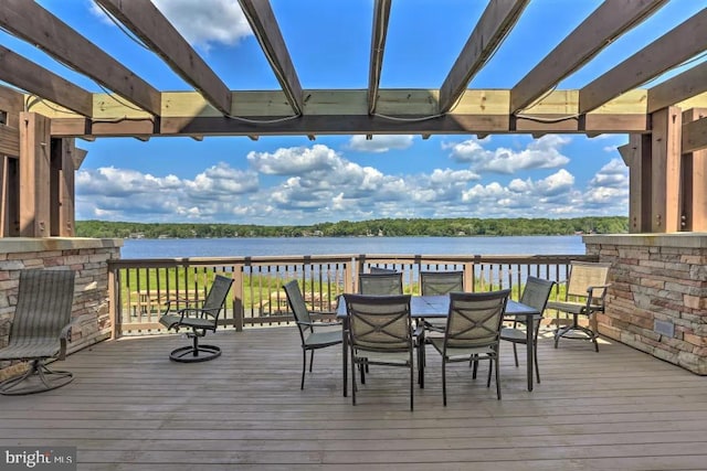 wooden terrace with a water view and a pergola