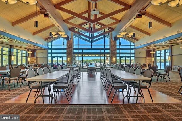 dining room with wood ceiling, high vaulted ceiling, and beamed ceiling