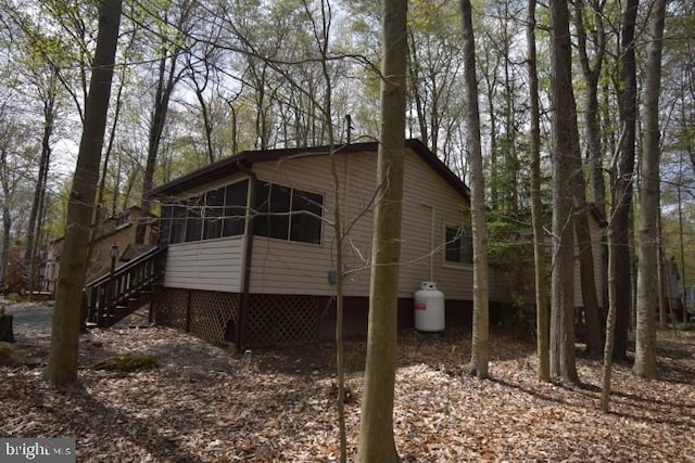 view of home's exterior featuring a sunroom