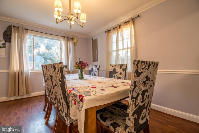 dining room featuring a wealth of natural light, dark wood-type flooring, a notable chandelier, and crown molding