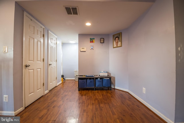 hall with dark hardwood / wood-style floors