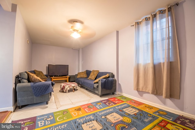 tiled living room with ceiling fan