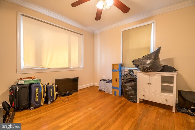 misc room with ceiling fan, crown molding, and hardwood / wood-style floors