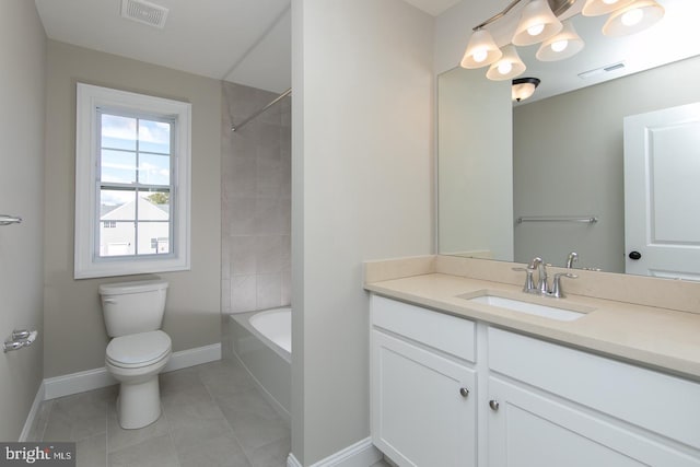 full bathroom featuring vanity, toilet, tiled shower / bath combo, and tile patterned flooring