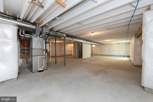 basement featuring heating unit