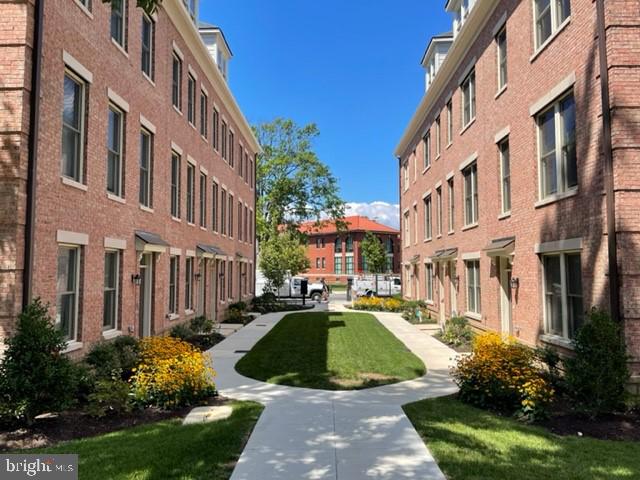 view of home's community featuring a lawn
