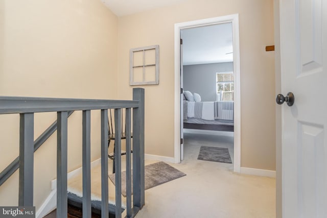 hallway featuring carpet flooring