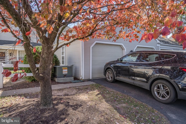 view of property exterior featuring a garage