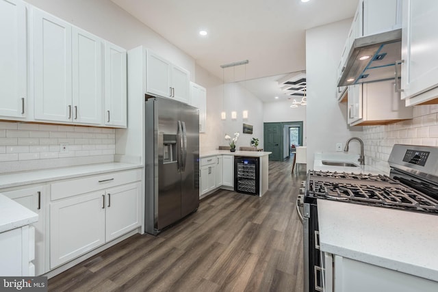 kitchen featuring white cabinetry, wine cooler, appliances with stainless steel finishes, and dark wood-type flooring