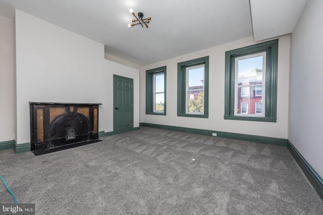 unfurnished living room featuring carpet floors