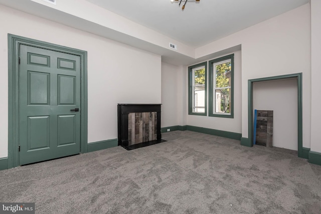 unfurnished living room featuring carpet floors