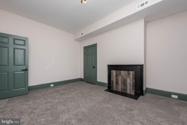 unfurnished living room featuring carpet floors