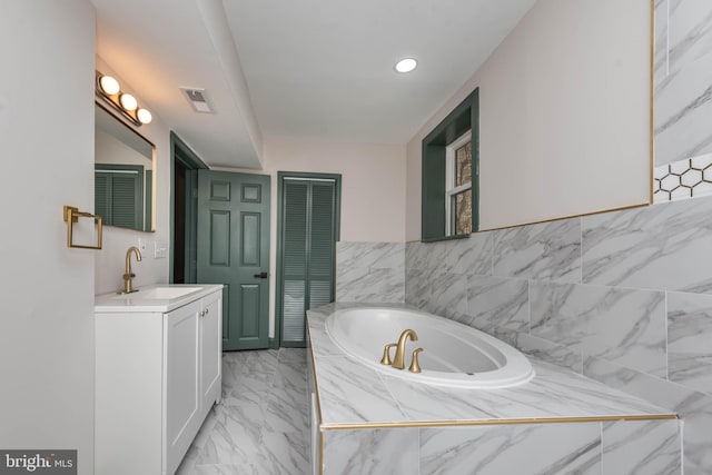 bathroom featuring vanity and a bathing tub