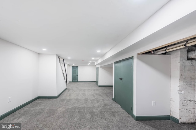 basement featuring carpet flooring