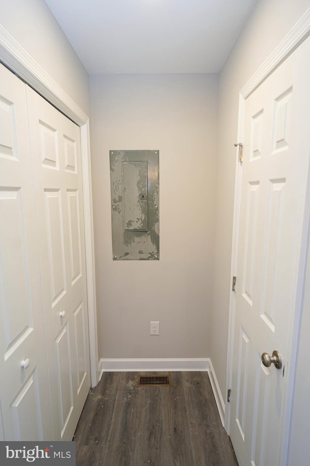 hall with dark hardwood / wood-style floors