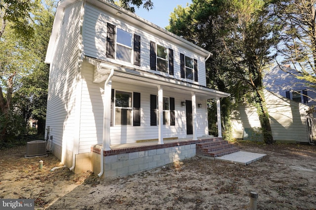 view of front of home featuring central air condition unit and covered porch