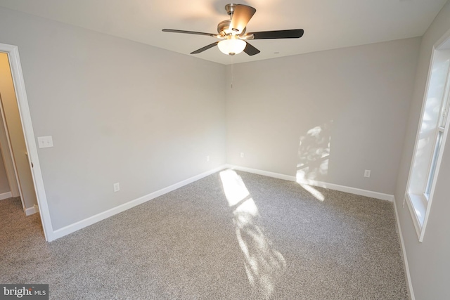 unfurnished room with carpet floors and ceiling fan