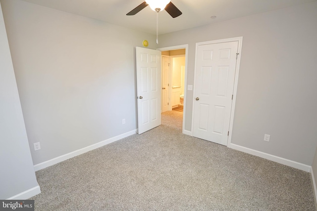 unfurnished bedroom featuring carpet floors and ceiling fan