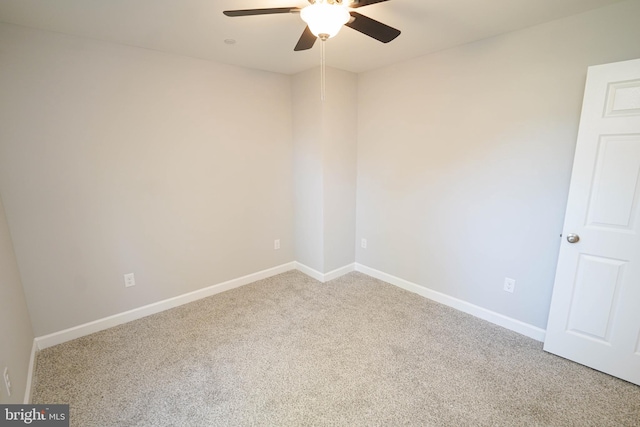 spare room with carpet flooring and ceiling fan