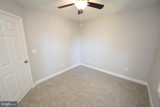 carpeted empty room featuring ceiling fan