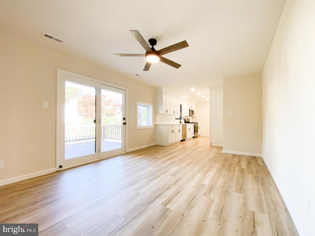 unfurnished living room with light hardwood / wood-style floors and ceiling fan