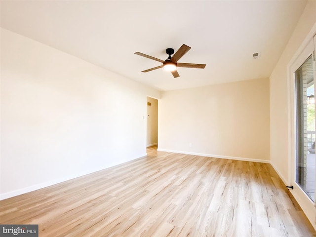 spare room featuring light hardwood / wood-style floors and ceiling fan