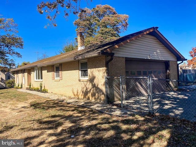 view of side of home featuring a garage