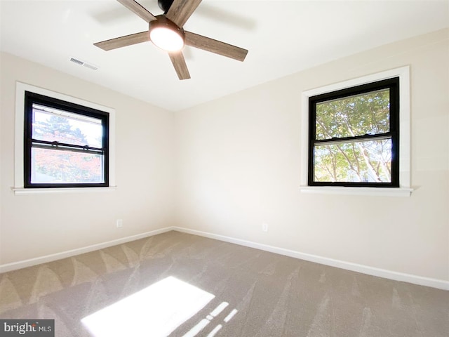 carpeted empty room with ceiling fan