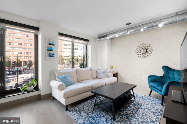 living room with concrete flooring